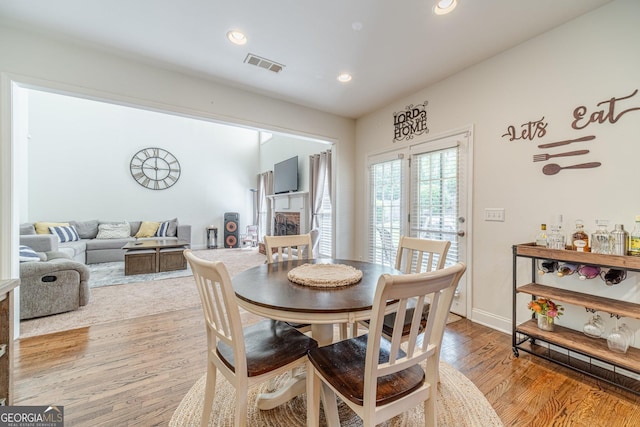 dining room featuring recessed lighting, visible vents, and light wood-type flooring
