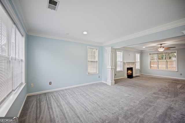 unfurnished living room with carpet, baseboards, crown molding, recessed lighting, and a fireplace with flush hearth