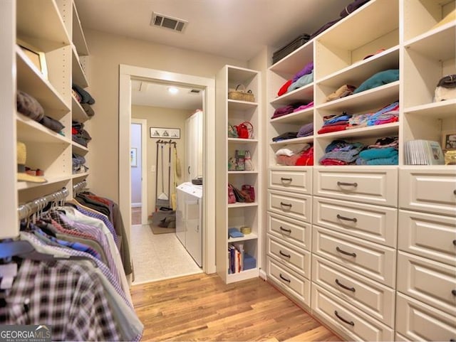 spacious closet with light wood-style flooring
