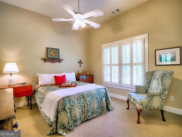 carpeted bedroom featuring vaulted ceiling, baseboards, and a ceiling fan