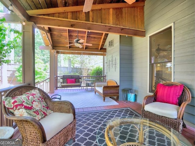 view of patio / terrace featuring a fireplace and ceiling fan