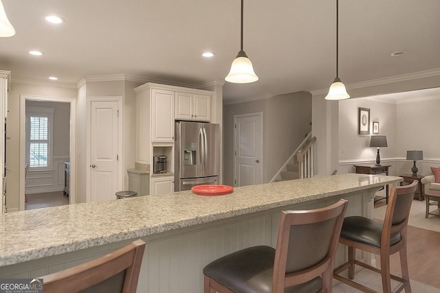 kitchen with appliances with stainless steel finishes, a sink, ornamental molding, recessed lighting, and tasteful backsplash
