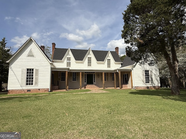 farmhouse-style home with a chimney, crawl space, covered porch, and a front yard