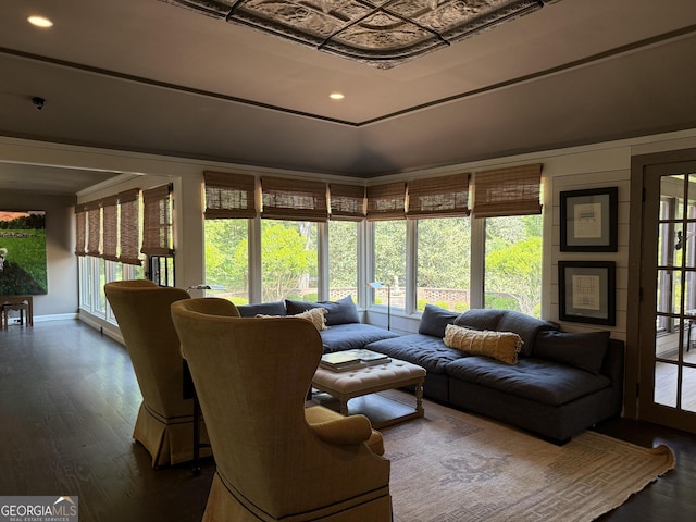 living area with recessed lighting, wood finished floors, and a wealth of natural light