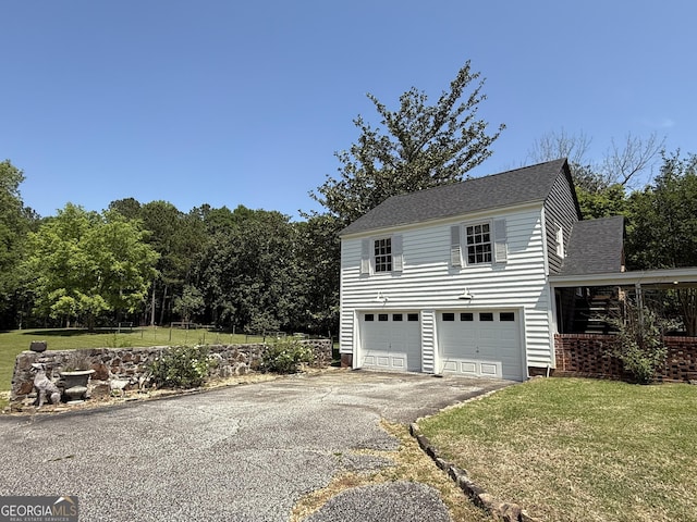 exterior space featuring aphalt driveway