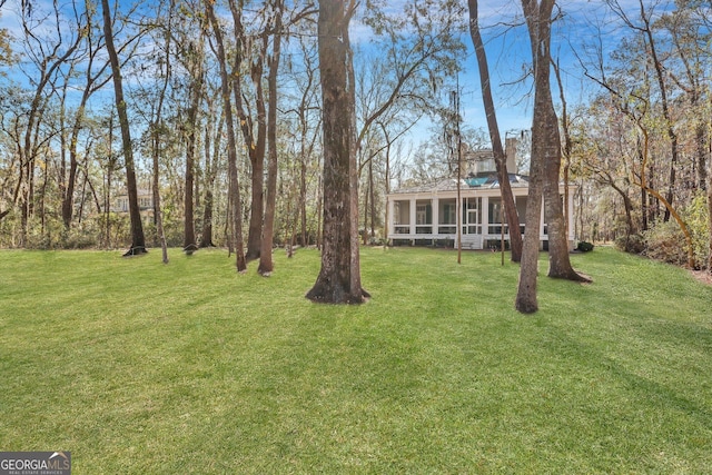 192 Myrtle Grove Ln, Richmond Hill, GA 31324 - view of yard with a sunroom