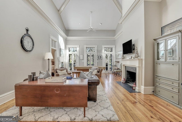 192 Myrtle Grove Ln, Richmond Hill, GA 31324 - living area featuring high vaulted ceiling, ceiling fan, light wood-type flooring, baseboards, and a high end fireplace