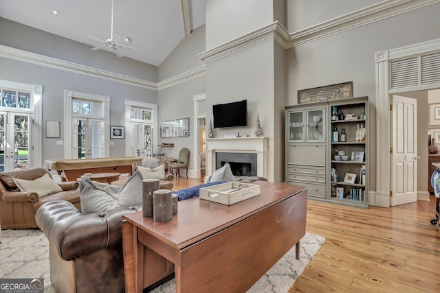 192 Myrtle Grove Ln, Richmond Hill, GA 31324 - living area featuring high vaulted ceiling, light wood-type flooring, ceiling fan, and a fireplace