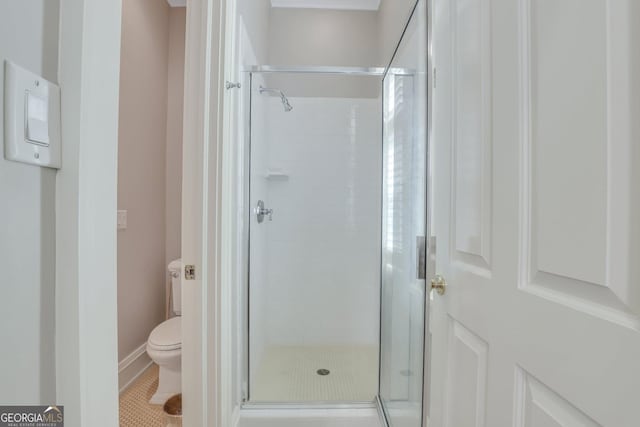 192 Myrtle Grove Ln, Richmond Hill, GA 31324 - bathroom with tile patterned floors, a stall shower, and toilet