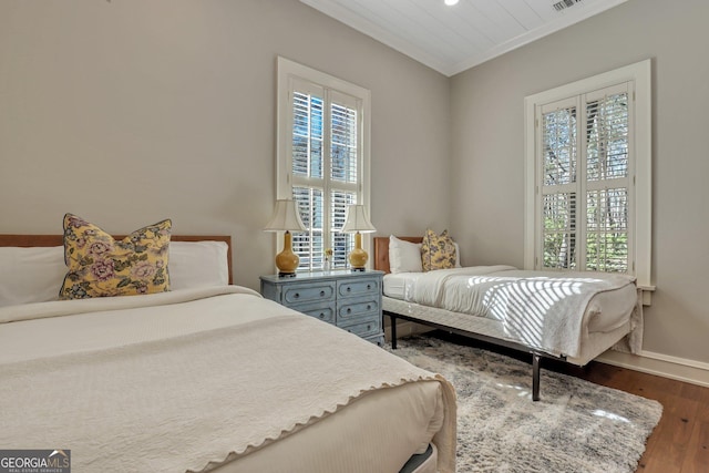 192 Myrtle Grove Ln, Richmond Hill, GA 31324 - bedroom with ornamental molding, visible vents, wood finished floors, and baseboards