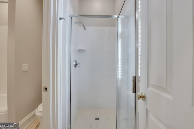 192 Myrtle Grove Ln, Richmond Hill, GA 31324 - full bathroom with tile patterned floors, toilet, and a shower stall