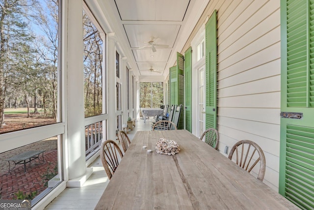 192 Myrtle Grove Ln, Richmond Hill, GA 31324 - sunroom with a ceiling fan and outdoor dining area