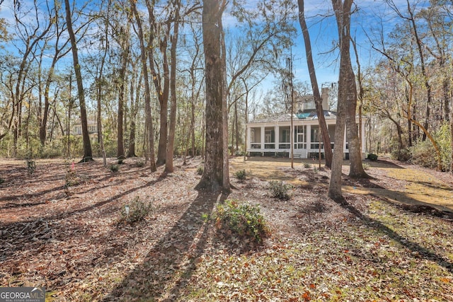 192 Myrtle Grove Ln, Richmond Hill, GA 31324 - exterior space featuring a sunroom