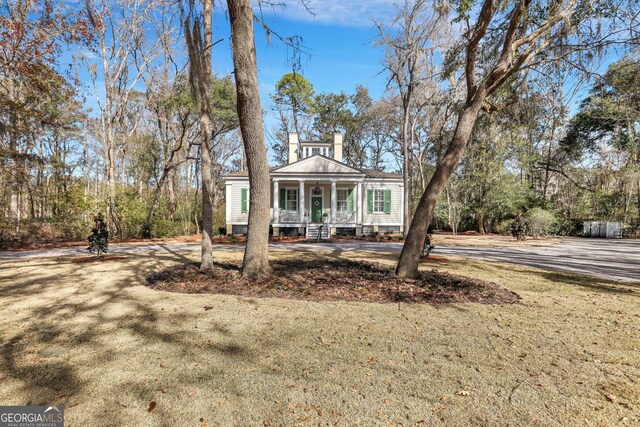 192 Myrtle Grove Ln, Richmond Hill, GA 31324 - view of front facade with covered porch