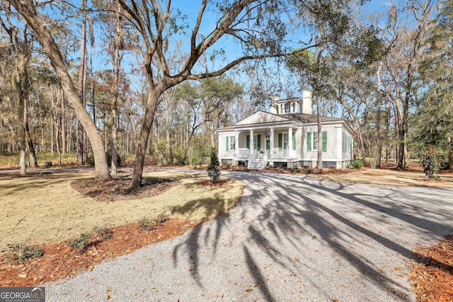 192 Myrtle Grove Ln, Richmond Hill, GA 31324 - view of front of home featuring driveway and a porch