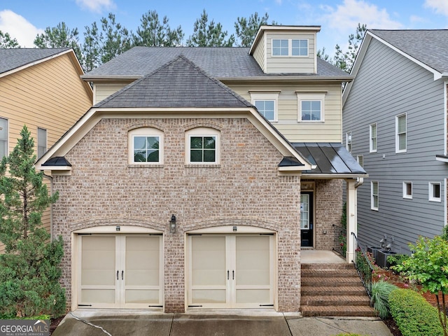 548 Myrtle Trace Ln, Suwanee, GA 30024 - view of front facade featuring brick siding, a garage, concrete driveway, and roof with shingles
