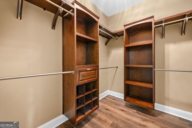 548 Myrtle Trace Ln, Suwanee, GA 30024 - spacious closet with wood finished floors