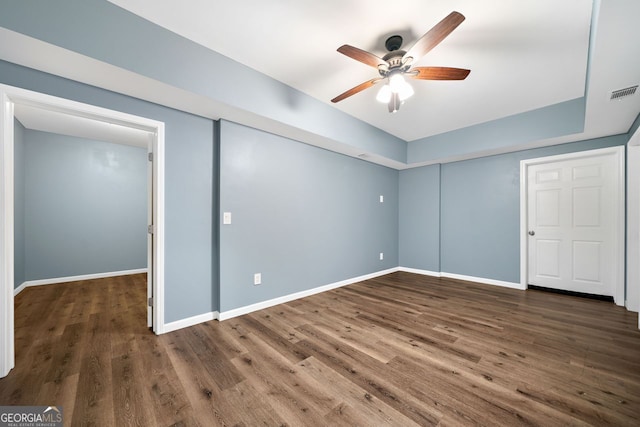 548 Myrtle Trace Ln, Suwanee, GA 30024 - unfurnished bedroom featuring wood finished floors, ceiling fan, and a closet