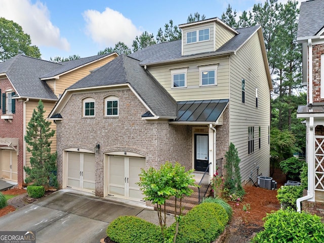 548 Myrtle Trace Ln, Suwanee, GA 30024 - view of front of property with a garage, concrete driveway, brick siding, a standing seam roof, and a shingled roof