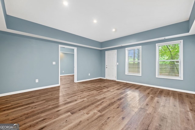 548 Myrtle Trace Ln, Suwanee, GA 30024 - empty room featuring wood finished floors and recessed lighting