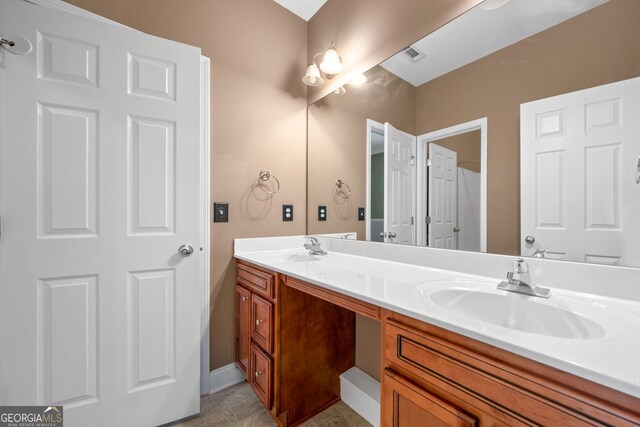 548 Myrtle Trace Ln, Suwanee, GA 30024 - bathroom with double vanity and baseboards