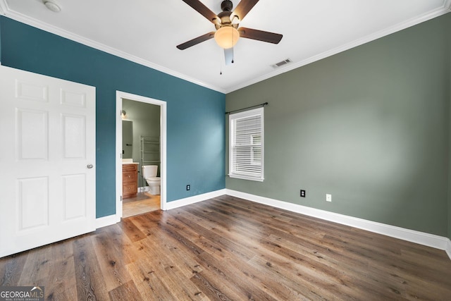 548 Myrtle Trace Ln, Suwanee, GA 30024 - unfurnished bedroom featuring ornamental molding, wood finished floors, ensuite bathroom, and ceiling fan