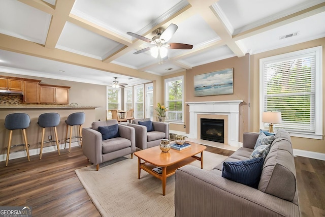 548 Myrtle Trace Ln, Suwanee, GA 30024 - living area featuring dark wood-style floors, coffered ceiling, ceiling fan, crown molding, and a glass covered fireplace