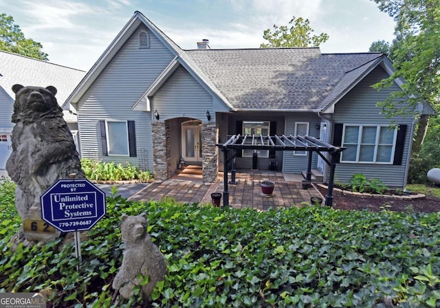 62 Eagles View Ct, Hayesville, NC 28904 - view of front of house featuring a shingled roof, a patio area, and a chimney