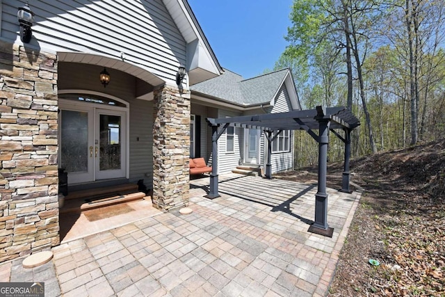 62 Eagles View Ct, Hayesville, NC 28904 - doorway to property featuring a pergola, french doors, stone siding, a patio, and roof with shingles