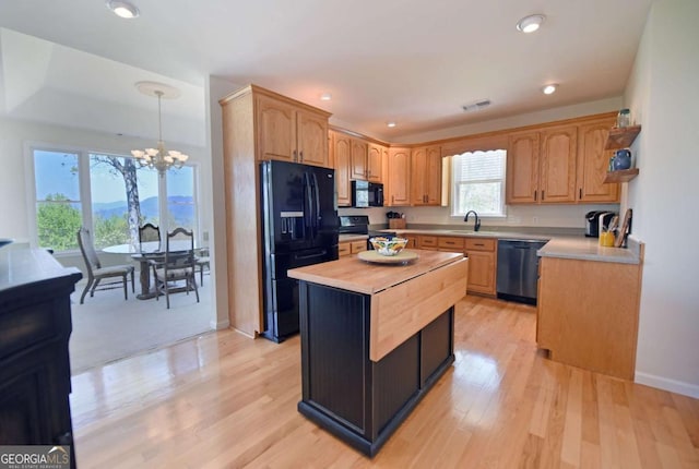 62 Eagles View Ct, Hayesville, NC 28904 - kitchen featuring black appliances, a chandelier, light wood-style flooring, a kitchen island, and recessed lighting
