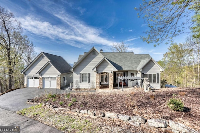 62 Eagles View Ct, Hayesville, NC 28904 - single story home with driveway, stone siding, and a garage