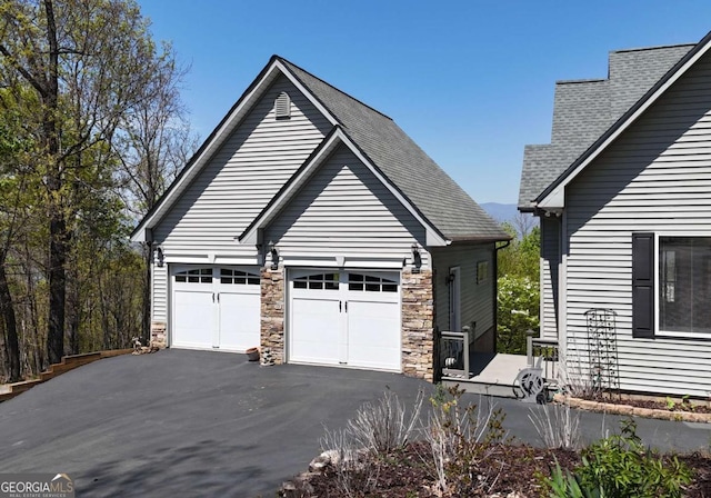 62 Eagles View Ct, Hayesville, NC 28904 - view of front of property featuring asphalt driveway, roof with shingles, stone siding, and a garage