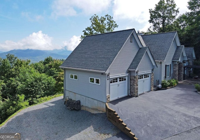 62 Eagles View Ct, Hayesville, NC 28904 - view of side of home featuring a shingled roof, stone siding, asphalt driveway, and a garage