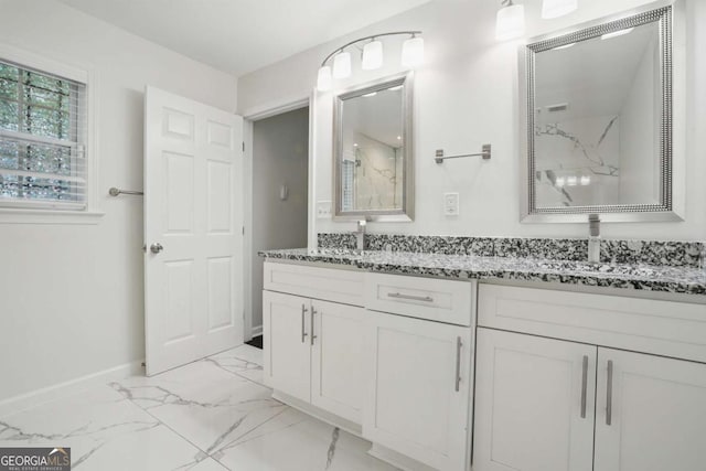 360 New Jersey Ave NW, Atlanta, GA 30314 - full bathroom featuring marble look tiles, a marble finish shower, baseboards, and double vanity
