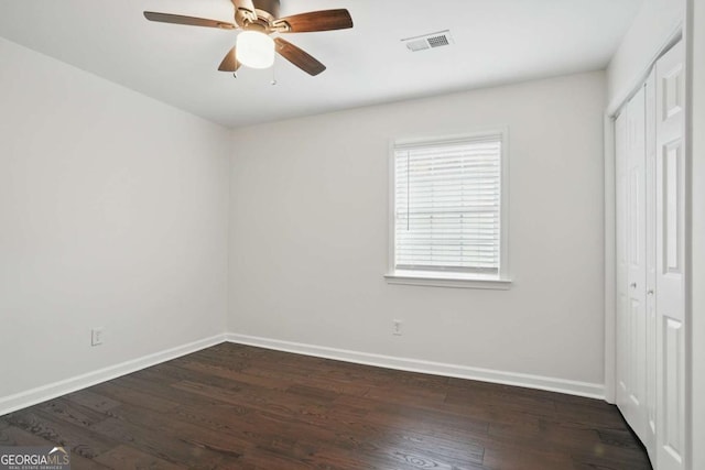 360 New Jersey Ave NW, Atlanta, GA 30314 - unfurnished bedroom with baseboards, dark wood finished floors, and a closet