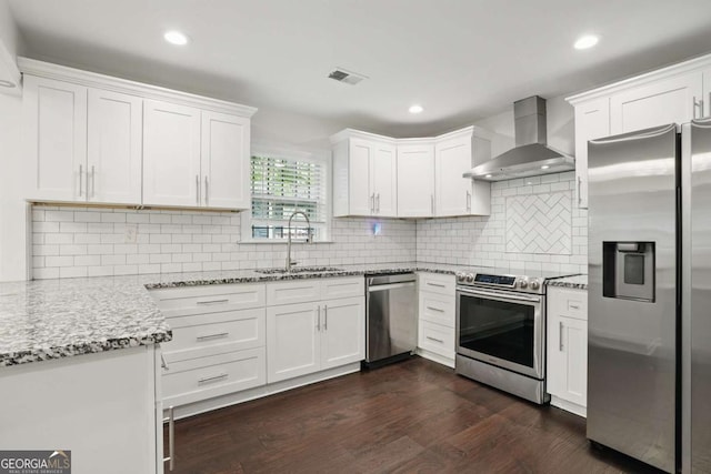 360 New Jersey Ave NW, Atlanta, GA 30314 - kitchen featuring appliances with stainless steel finishes, wall chimney exhaust hood, a sink, white cabinets, and light stone countertops