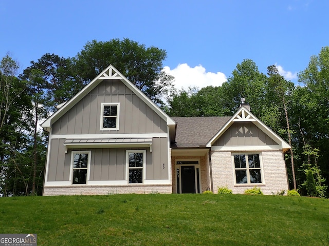 45 Hometown Ct, Jefferson, GA 30549 - view of front of property with brick siding, board and batten siding, a front lawn, and a standing seam roof