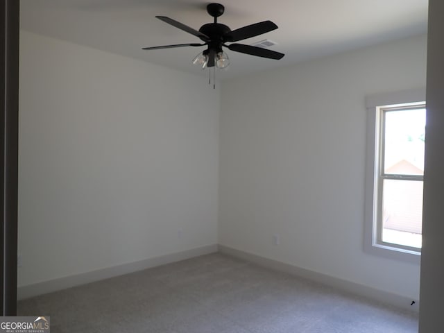 45 Hometown Ct, Jefferson, GA 30549 - spare room featuring light colored carpet, ceiling fan, and baseboards