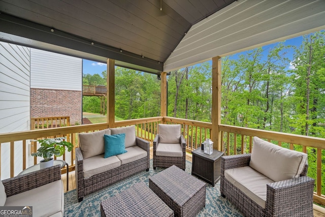 wooden terrace featuring outdoor lounge area