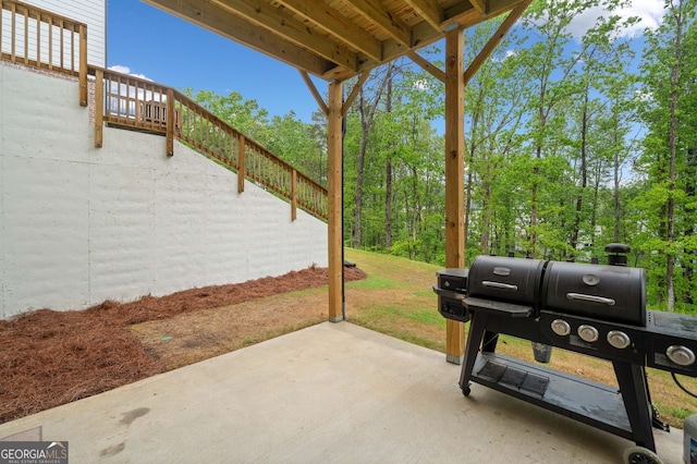 view of patio with stairway and area for grilling