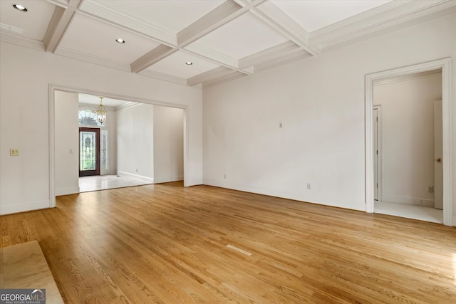 5510 Conway Dr, Marietta, GA 30068 - unfurnished living room with beamed ceiling, a notable chandelier, light wood finished floors, and coffered ceiling