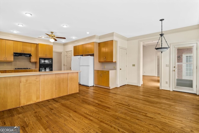 5510 Conway Dr, Marietta, GA 30068 - kitchen featuring range hood, ornamental molding, black appliances, and wood finished floors