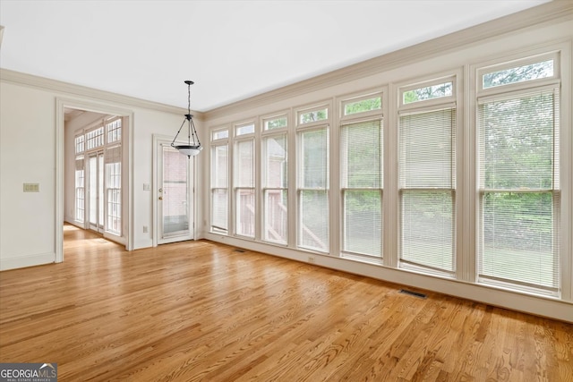 5510 Conway Dr, Marietta, GA 30068 - unfurnished dining area featuring baseboards, visible vents, ornamental molding, and light wood finished floors