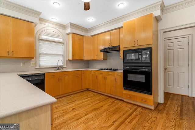 5510 Conway Dr, Marietta, GA 30068 - kitchen featuring ornamental molding, under cabinet range hood, black appliances, and light countertops
