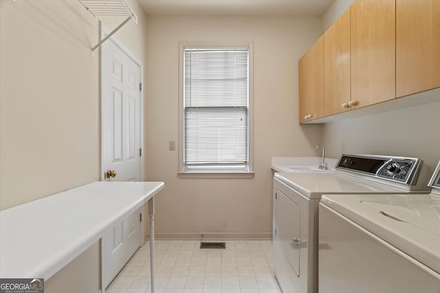 5510 Conway Dr, Marietta, GA 30068 - clothes washing area with visible vents, baseboards, separate washer and dryer, a sink, and cabinet space