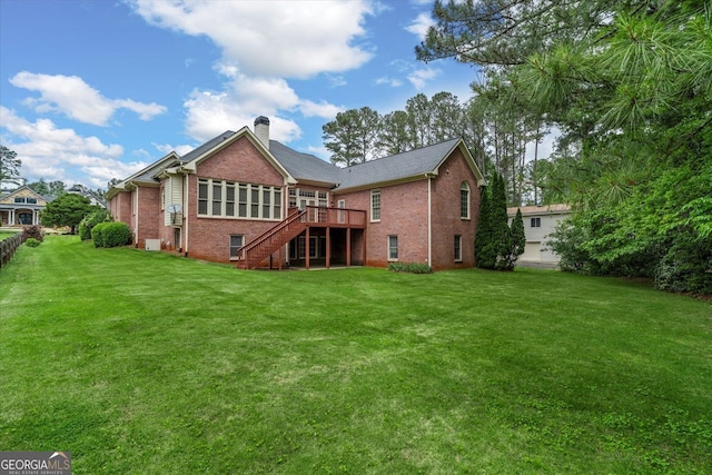 5510 Conway Dr, Marietta, GA 30068 - back of property with a deck, a chimney, brick siding, a lawn, and stairway