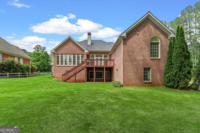 5510 Conway Dr, Marietta, GA 30068 - rear view of property featuring fence, brick siding, stairway, a chimney, and a lawn