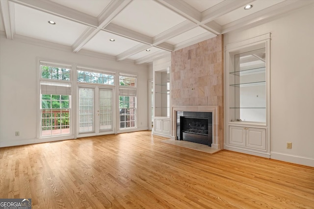 5510 Conway Dr, Marietta, GA 30068 - unfurnished living room featuring beam ceiling, coffered ceiling, light wood-type flooring, and a tile fireplace