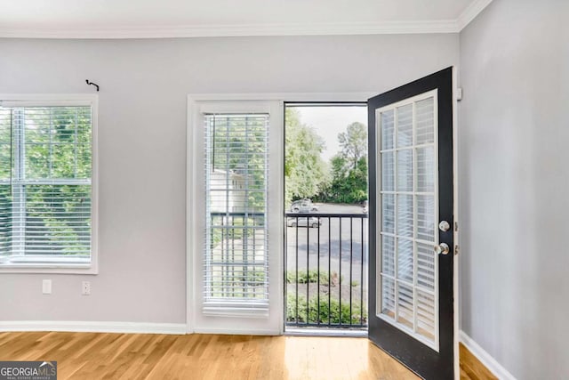 unfurnished bedroom with connected bathroom, baseboards, a ceiling fan, and wood finished floors