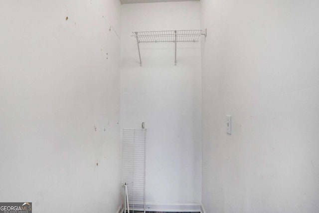 garage with electric panel and a garage door opener